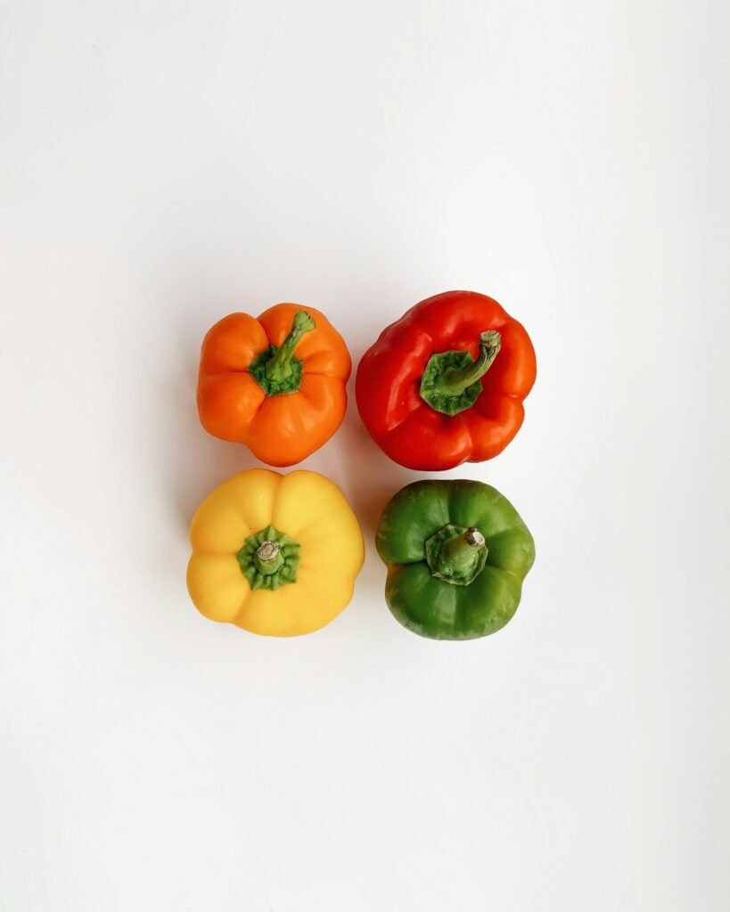 Fresh red and yellow peppers ready for harvest